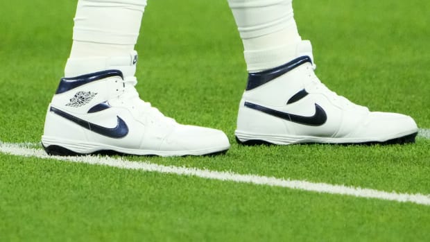 View of Dallas Cowboys quarterback Dak Prescott's white and blue Air Jordan cleats.